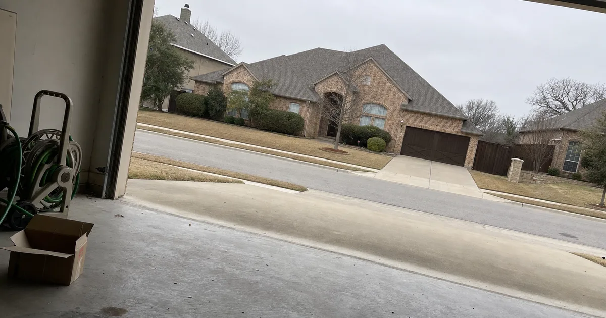 View from inside a garage looking out to a Southlake, TX street — same-day garage door repair