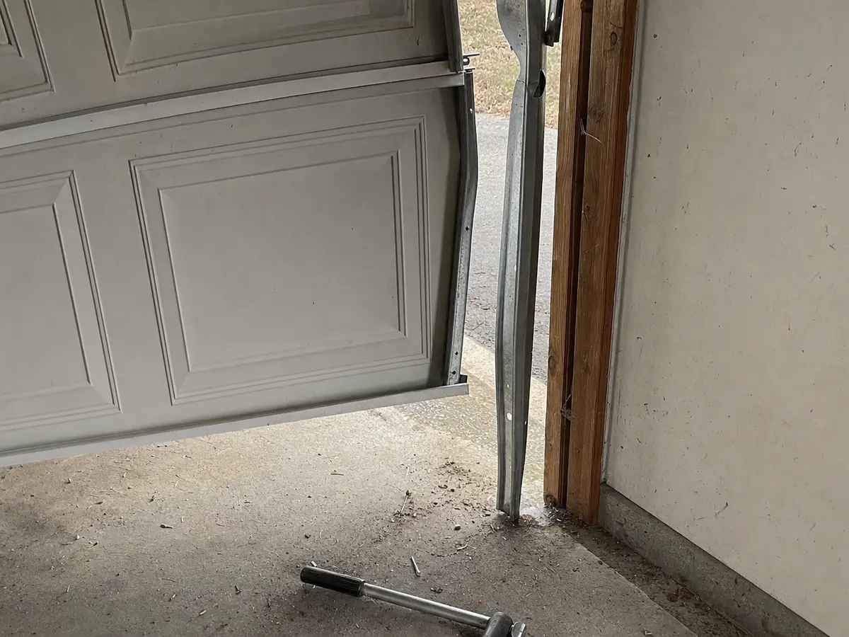 Garage door panel off its track — evidence photo taken before repair in Southlake TX